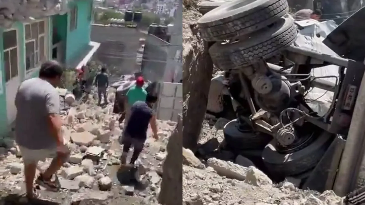 Camión de carga cae entre cuatro casas en Naucalpan