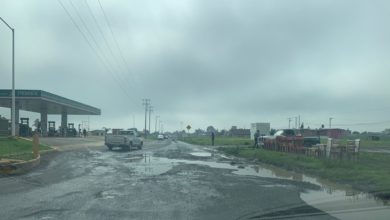 Calle dañada por el tránsito pesado